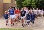 12 December 2009; Brendan Cummins, Tipperary, and PJ Ryan, Kilkenny, lead out the 2008 All-Stars and 2009 All-Stars teams. GAA Hurling All-Stars Tour 2009, sponsored by Vodafone, 2008 All-Stars (red) v 2009 All-Stars (white), Hurlingham Hurling Club, Hurlingham, Buenos Aires, Argentina. Picture credit:  Ray McManus / SPORTSFILE