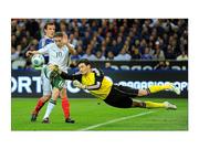 18 November 2009; France goalkeeper Hugo Lloris saves at the feet of Republic of Ireland's Robbie Keane. FIFA 2010 World Cup Qualifying Play-off 2nd Leg, Republic of Ireland v France, Stade de France, Saint-Denis, Paris, France. Picture credit: Stephen McCarthy / SPORTSFILE