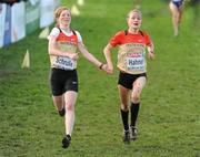 13 December 2009; Mareike Schrulle, left, and Anna Hahner, come home together to finish in 13th and 12th respectively, in the Under 23 Women's Event at the 16th SPAR European Cross Country Championships. Santry Demesne, Santry, Co. Dublin. Picture credit: Brendan Moran / SPORTSFILE *** Local Caption ***