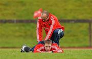 16 December 2009; Munster's Tomas O'Leary is attended to by physio Neil Tucker during squad training ahead of their Heineken Cup game against Perpignan on Sunday. University of Limerick, Limerick. Picture credit: Diarmuid Greene / SPORTSFILE