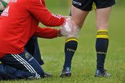 16 December 2009; Munster's Keith Earls has an ice pack applied to his leg by physio Neil Tucker during squad training ahead of their Heineken Cup game against Perpignan on Sunday. University of Limerick, Limerick. Picture credit: Diarmuid Greene / SPORTSFILE