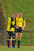 16 December 2009; Munster's Paul Warwick, left, assists team-mate Keith Earls with the strap of his heart rate monitor during squad training ahead of their Heineken Cup game against Perpignan on Sunday. University of Limerick, Limerick. Picture credit: Diarmuid Greene / SPORTSFILE