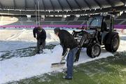 19 December 2009; Ground staff removing snow from the frozen pitch before the pitch inspection. Heineken Cup Pool 4 Round 4, Stade Francais v Ulster, King Baudoun Stadium, Brussels, Belgium. Picture credit: Oliver McVeigh / SPORTSFILE