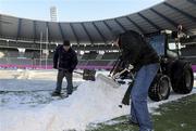 19 December 2009; Ground staff removing snow from the frozen pitch before the pitch inspection. Heineken Cup Pool 4 Round 4, Stade Francais v Ulster, King Baudoun Stadium, Brussels, Belgium. Picture credit: Oliver McVeigh / SPORTSFILE