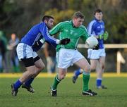 19 December 2009; Graham Dillon, Trinity Gaels, Dublin North, is tackled by Ciaran Farelly, Fingallians, Fingal. Dublin Regional Football Tournament, Fingal (Blue) v Dublin North (Green), Innisfails GAA Grounds, Balgriffin, Dublin. Picture credit: Ray McManus / SPORTSFILE