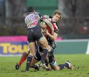 20 December 2009; Andrew Trimble, Ulster, is tackled by Guillaume Bousses, Stade Francais. Heineken Cup Pool 4 Round 4, Stade Francais v Ulster, Stade Jean Bouin, Paris, France. Picture credit: Oliver McVeigh / SPORTSFILE