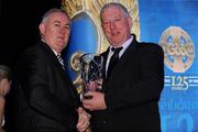 19 December 2009; Gerard Donnelly accepts the Lory Meagher Champion 15 Award on behalf of his son Stephen Donnelly, Tyrone, from Uachtarán CLG Criostóir Ó Cuana. Christy Ring/Nicky Rackard/Lory Meagher Champion 15 & Rounder All-Star Awards 2009, Croke Park, Dublin. Photo by Sportsfile