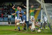 13 February 2016; Paul Durcan, Ballyboden St Enda's, clears his lines as Michael Quinlivan, Clonmel Commercials, protests with umpires. AIB GAA Football Senior Club Championship, Semi-Final, Ballyboden St Enda's v Clonmel Commercials. O'Moore Park, Portlaoise, Co. Laois. Picture credit: Piaras Ó Mídheach / SPORTSFILE