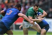 13 February 2016; Robbie Henshaw, Ireland, is tackled by Guilhem Guirado, right, and Uini Atonio, France. RBS Six Nations Rugby Championship, France v Ireland. Stade de France, Saint Denis, Paris, France. Picture credit: Ramsey Cardy / SPORTSFILE