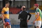 14 February 2016; Referee Sean Cleere reaches for the red card in his back pocket before showing it to Clare's Peter Duggan and Conor Doughan, Offaly. Allianz Hurling League, Division 1B, Round 1, Clare v Offaly. Cusack Park, Ennis, Co. Clare. Picture credit: Ray McManus / SPORTSFILE