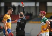 14 February 2016; Clare's Peter Duggan and Conor Doughan, Offaly, are both shown a red card by referee Sean Cleere. Allianz Hurling League, Division 1B, Round 1, Clare v Offaly. Cusack Park, Ennis, Co. Clare. Picture credit: Ray McManus / SPORTSFILE