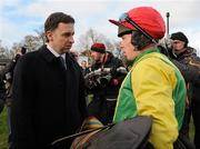26 December 2009; Trainer Henry de Bromhead in conversation with jockey Andrew Lynch after Sizing Europe won the Bord na Mona - with Nature Novice Steeplechase. Leopardstown Racecourse, Dublin. Picture credit: Pat Murphy / SPORTSFILE
