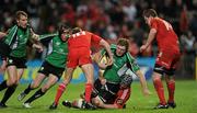 26 December 2009; Michael Swift, Connacht, is tackled by Munster players Mick O'Driscoll and Ronan O'Gara. Celtic League, Munster v Connacht, Thomond Park, Limerick. Picture credit: Ray McManus / SPORTSFILE