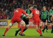 26 December 2009; Michael Swift, Connacht, is tackled by Munster players Billy Holland, left, and Ronan O'Gara. Celtic League, Munster v Connacht, Thomond Park, Limerick. Picture credit: Ray McManus / SPORTSFILE