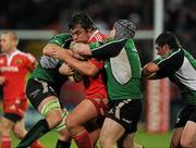 26 December 2009; Tony Buckley, Munster, is tackled by Jamie Hagan and Michael Swift, Connacht. Celtic League, Munster v Connacht, Thomond Park, Limerick. Picture credit: Ray McManus / SPORTSFILE