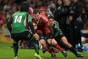 26 December 2009; Denis Hurley, Munster, is tackled by Troy Nathan, 14, and Ian Keatley, Connacht. Celtic League, Munster v Connacht, Thomond Park, Limerick. Picture credit: Ray McManus / SPORTSFILE