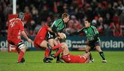 26 December 2009; Connacht captain Gavin Duffy passes to Miah Nikora as he is tackled by Munster players Mick O'Driscoll, 4, Tom Gleeson and Ronan O'Gara. Celtic League, Munster v Connacht, Thomond Park, Limerick. Picture credit: Ray McManus / SPORTSFILE