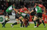 26 December 2009; Julien Brugnaut, Munster, is tackled by Mike McComish, centre, George Naoupu, left, and Johnny O'Connor, 7, Connacht. Celtic League, Munster v Connacht, Thomond Park, Limerick. Picture credit: Diarmuid Greene / SPORTSFILE