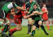 26 December 2009; Conor O'Loughlin, Connacht, is tackled by Billy Holland, Munster. Celtic League, Munster v Connacht, Thomond Park, Limerick. Picture credit: Diarmuid Greene / SPORTSFILE