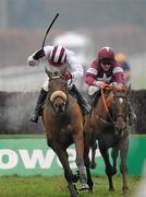 28 December 2009; Pandorama, left, with David Condon up, lead Weapon's Amnesty, with davy Russell up, on their way to winning the Knight Frank Novice Steeplechase. Leopardstown Christmas Racing Festival 2009, Leopardstown Racecourse, Dublin. Photo by Sportsfile
