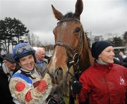 29 December 2009; Jockey Sam Thomas and Stablehand Emily Hough with What A Friend after winning the Lexus Steeplechase. Leopardstown Christmas Racing Festival 2009, Leopardstown Racecourse, Dublin. Picture credit: Brian Lawless / SPORTSFILE
