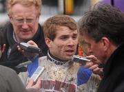 29 December 2009; Jockey Sam Thomas is interviewed after winning the Lexus Steeplechase aboard What A Friend. Leopardstown Christmas Racing Festival 2009, Leopardstown Racecourse, Dublin. Picture credit: Brian Lawless / SPORTSFILE