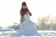 8 January 2010; Seven year old Leah Browne puts a hat on her snowman at home in Hacketstown, Co. Carlow. Picture credit: Matt Browne / SPORTSFILE