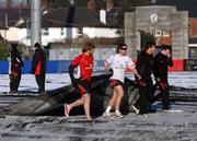 8 January 2010; Ulster players helping put covers on the pitch at Ravenhill, in preparation for a massive marquee and heat blowers to ensure next Friday night's Heineken Cup clash with Edinburgh beats the big freeze. Ravenhill Park, Belfast, Co. Antrim. Picture credit: John Dickson / SPORTSFILE