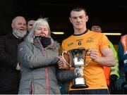 15 February 2016; Annette Billings, wife of the late Dave Billings, presents the Daithí Billings cup to winning DCU captain Barry Kerr. Fresher 'A' Football Championship Final. University College Dublin v Dublin City University. Croke Park, Dublin. Picture credit: Piaras Ó Mídheach / SPORTSFILE