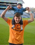 15 February 2016; Michael Miller, DCU, celebrates with his 6-month-old brother Rua Martin Miller. Fresher 'A' Football Championship Final. University College Dublin v Dublin City University. Croke Park, Dublin. Picture credit: Cody Glenn / SPORTSFILE