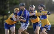 17 January 2010; Ronan Good, WIT, in action against, from left, Cian Dillon, Paddy Vaughan and Domhnall O'Donovan, Clare. Waterford Crystal Cup, Clare v WIT, Meelick, Co. Clare. Picture credit: Diarmuid Greene / SPORTSFILE