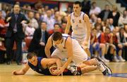 17 January 2010; Kyle Hosford, UCC Demons, attempts to hold possession under pressure from Ger Noonan, Neptune. 2010 Basketball Ireland Men's SuperLeague National Cup Semi-Final, UCC Demons v Neptune, Neptune Stadium, Cork. Picture credit: Brendan Moran / SPORTSFILE