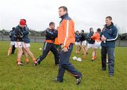 16 January 2010; Armagh assistant Justin McNulty. centre, and manager Paddy O'Rourke, right, during the team warm up. Barrett Sports Lighting Dr. McKenna Cup, Group A, Armagh v UUJ,  St Oliver Plunkett Park, Crossmaglen, Co. Armagh. Picture credit: Oliver McVeigh / SPORTSFILE *** Local Caption ***