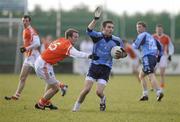 16 January 2010; Ciaran McGinley, UUJ, in action against Brian McCone, Armagh. Barrett Sports Lighting Dr. McKenna Cup, Group A, Armagh v UUJ,  St Oliver Plunkett Park, Crossmaglen, Co. Armagh. Picture credit: Oliver McVeigh / SPORTSFILE *** Local Caption ***