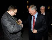 20 January 2010; Manchester United manager Sir Alex Ferguson signs an autograph on his arrival for a talk at the Trinity College Philosophical Society. Graduates Memorial Building, Trinity College, Dublin. Picture credit: Stephen McCarthy / SPORTSFILE