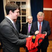 20 January 2010; Manchester United manager Sir Alex Ferguson signs an autograph for student Howard Helen at the Trinity College Philosophical Society. Graduates Memorial Building, Trinity College, Dublin. Picture credit: Stephen McCarthy / SPORTSFILE