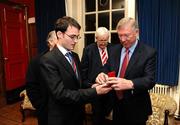 20 January 2010; Manchester United manager Sir Alex Ferguson receives a medal  from Brendan Curran, President of the Trinity College Philosophical Society at the Trinity College Philosophical Society. Graduates Memorial Building, Trinity College, Dublin. Picture credit: Stephen McCarthy / SPORTSFILE