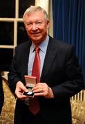 20 January 2010; Manchester United manager Sir Alex Ferguson receives a medal at the Trinity College Philosophical Society. Graduates Memorial Building, Trinity College, Dublin. Picture credit: Stephen McCarthy / SPORTSFILE