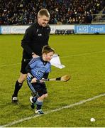 20 February 2016; Linesman Barry Kelly contests for a stray ball with mascot Evan Coyne, aged 8, from Trinity Gaels, before the game. Allianz Hurling League, Division 1A, Round 2, Dublin v Galway. Parnell Park, Dublin. Picture credit: Piaras Ó Mídheach / SPORTSFILE