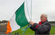 21 February 2016; John Nolan, Innovate Wexford Park groundsman, and father of Irish boxer Adam Nolan raises the tricolour ahead of the game. Allianz Hurling League, Division 1B, Round 2, Wexford v Clare. Innovate Wexford Park, Wexford. Picture credit: Piaras Ó Mídheach / SPORTSFILE