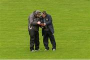 21 February 2016; Clare manager Davy Fitzgerald examines the Clare teamsheet with TG4's Eoin Mac Craith ahead of the game. Allianz Hurling League, Division 1B, Round 2, Wexford v Clare. Innovate Wexford Park, Wexford. Picture credit: Piaras Ó Mídheach / SPORTSFILE