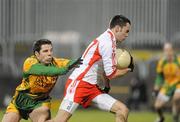 20 January 2010; Kyle Coney, Tyrone, in action against Kevin Cassidy, Donegal. Barrett Sports Lighting Dr. McKenna Cup, Group B, Donegal v Tyrone, MacCumhaill Park, Ballybofey, Co. Donegal. Picture credit: Oliver McVeigh / SPORTSFILE
