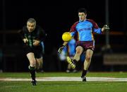 21 January 2010; Joey McGuirk, St. Declan's All-Stars, offloads a pass as referee Pat McEnaney ducks for cover. St. Declan's All-Stars v Dublin Senior Hurlers, St. Brigid's GAA, Russell Park, Dublin. Picture credit: Stephen McCarthy / SPORTSFILE
