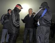 23 January 2010; Referee, Seamus McGonigle, chats with Tyrone manager, Mickey Harte and Cavan manager, Tommy Carr, as the match is delayed 45 minutes due to fog. Barrett Sports Lighting Dr. McKenna Cup, Group B, Tyrone v Cavan, Healy Park, Omagh, Co. Tyrone. Picture credit: Oliver McVeigh / SPORTSFILE