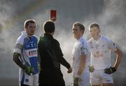 24 January 2010; Referee Syl Doyle issues a straight red card to Billy Sheehan, Laois, as Kildare players Morgan O'Flaherty and John Doyle, right, look on. He also sent off Laois players Peter O'Leary and Kevin Meaney after an altercation during the game. O'Byrne Cup Quarter-Final, Laois v Kildare, O'Moore Park, Portlaoise, Co. Laois. Photo by Sportsfile