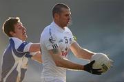 24 January 2010; Ronan Sweeney, Kildare, in action against Denis Booth, Laois. O'Byrne Cup Quarter-Final, Laois v Kildare, O'Moore Park, Portlaoise, Co. Laois. Photo by Sportsfile