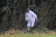 24 January 2010; An umpire gets the ball back after it went into the trees during the game. Connacht FBD League, Group A, Round 2, NUIG v Roscommon, Dangan GAA Grounds, Dangan, Co. Galway. Picture credit: Ray Ryan / SPORTSFILE