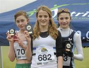 23 January 2010; Lindra Conroy, Mullingar Harriers AC, third place, left, Rachel Dunn, Edinburgh AC, winner, centre, and Yasmin Wilson, City of Lisburn AC, second place, celebrate with their plaques after the Under 15 Girls Race. Antrim IAAF International Cross Country. Greenmount Campus, Belfast, Co. Antrim. Picture credit: Oliver McVeigh / SPORTSFILE