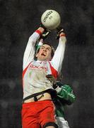 27 January 2010; Justin McMahon, Tyrone, in action against Rory Foy, Fermanagh. Barrett Sports Lighting Dr. McKenna Cup Semi-Final, Tyrone v Fermanagh, Healy Park, Omagh, Co. Tyrone. Picture credit: Oliver McVeigh / SPORTSFILE
