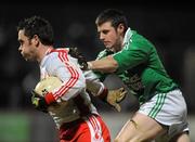 27 January 2010; Martin Penrose, Tyrone, in action against Michael Jones, Fermanagh. Barrett Sports Lighting Dr. McKenna Cup Semi-Final, Tyrone v Fermanagh, Healy Park, Omagh, Co. Tyrone. Picture credit: Oliver McVeigh / SPORTSFILE